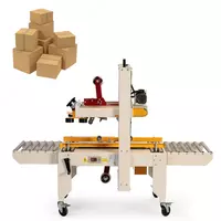 Qutilarning yuqori va pastki qismlariga skotch yopishtirish uskunasi