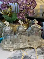 Серебрянный набор из трёх стеклянных баночек с цветочным верхом для специй