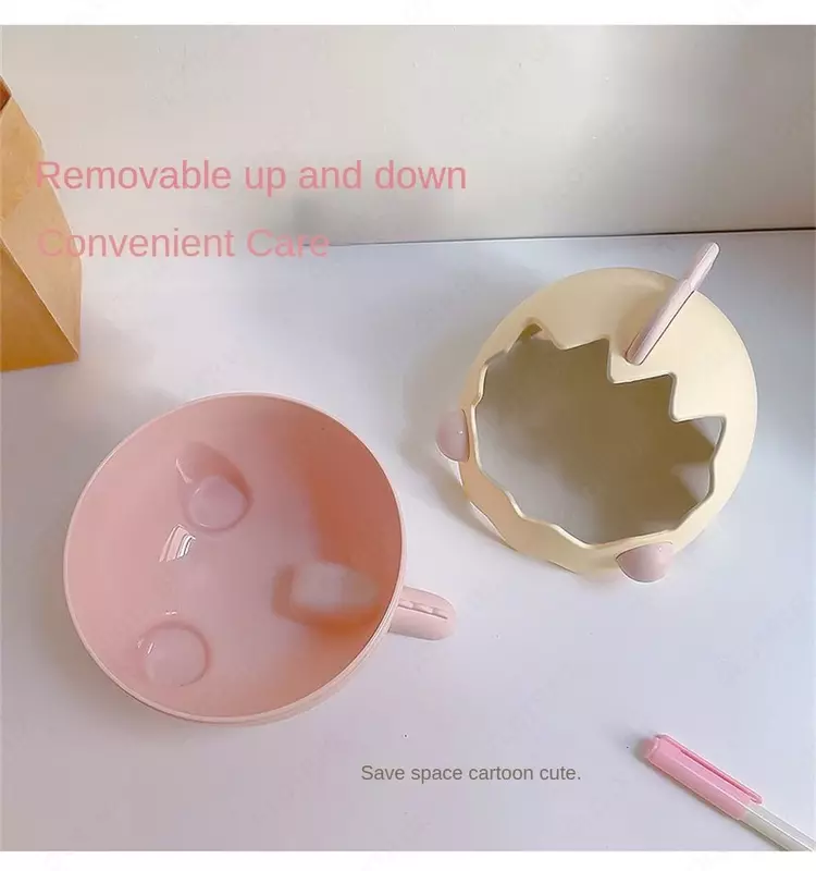 Органайзер в виде мультяшного динозавра в яичной скорлупе.