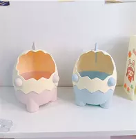 40 000 сум Органайзер в виде мультяшного динозавра в яичной скорлупе.