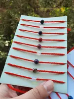 Красные нити с натуральными камнями.