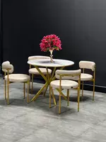 Элегантный круглый стол с четырьмя стульями