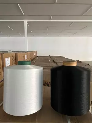 Полиэстеровие нити DTY 150/48 NIM белый/черный производство Китай. - 1.9 сум от 100 кг.