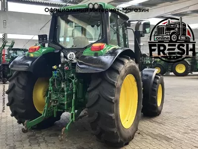 Колесный трактор John Deere 6115M