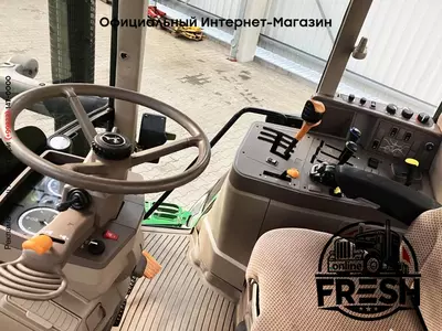 Колесный трактор John Deere 6115M