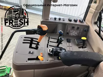 Колесный трактор John Deere 6115M