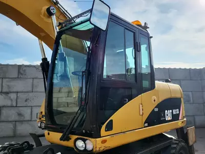 Колесный экскаватор Caterpillar M313 D