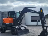 780 002 596 сум Колесный экскаватор Develon DX60 WN ECO-1