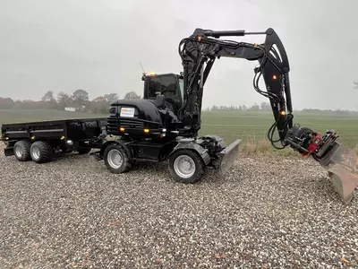   Колёсный экскаватор Takeuchi TB295 W