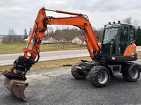 Doosan DX55WK g‘ildirakli ekskavatori