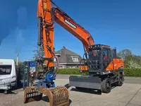 Колесный экскаватор Doosan DX210W-5 с сортировочным грейфером Zijtveld S1202D