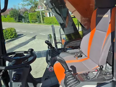 Колесный экскаватор Doosan DX210W-5 с сортировочным грейфером Zijtveld S1202D